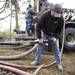 Cribley Drilling Company worker Matt Wing works in Paul Hickman's backyard as they crew installs a geo-thermal well. Melanie Maxwell I AnnArbor.com